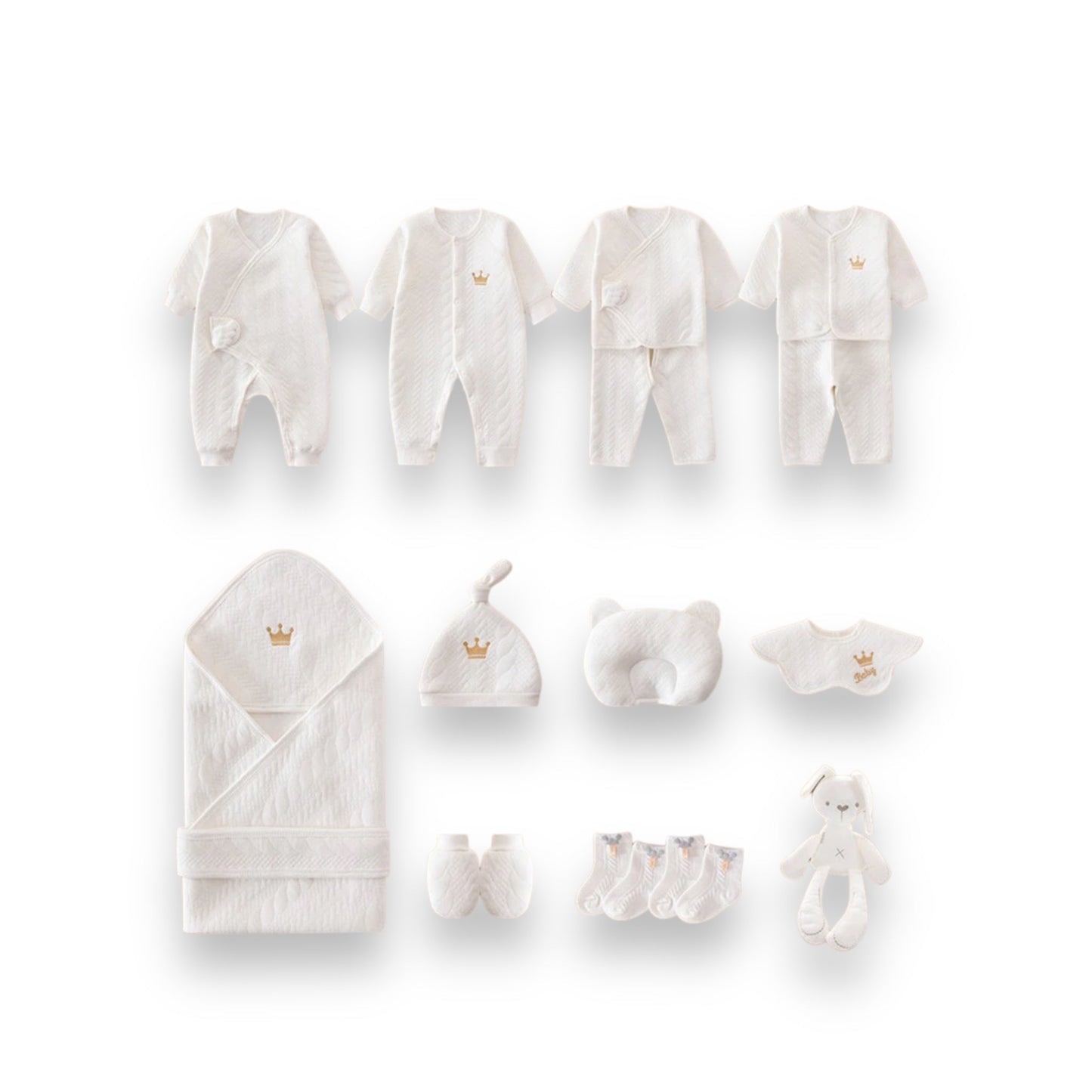 A collection of white newborn baby clothes and accessories, including onesies, hats, booties, a blanket, and a plush toy.